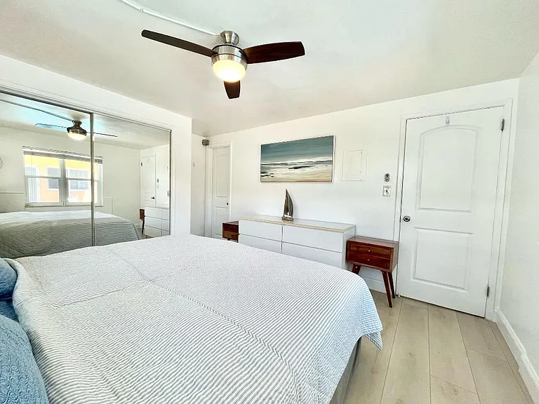 king size bed, dresser and closet