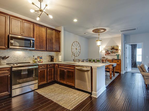 Kitchen open to dining & den, new microwave, oven, dishwasher, new quartz tops with marble backsplash, new sink with new faucet & garbage disposal