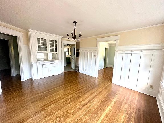 Another view of the formal dining room with built in cabinetry
