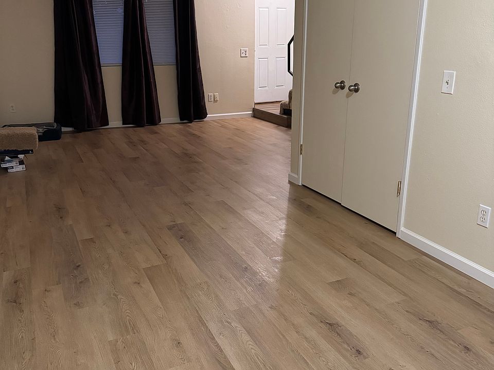 View from dining area/sliding door towards front door (pantry doors on right)