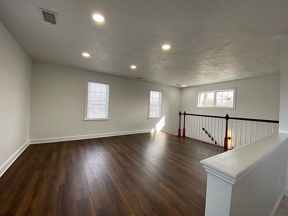 Living room with new white blinds just installed