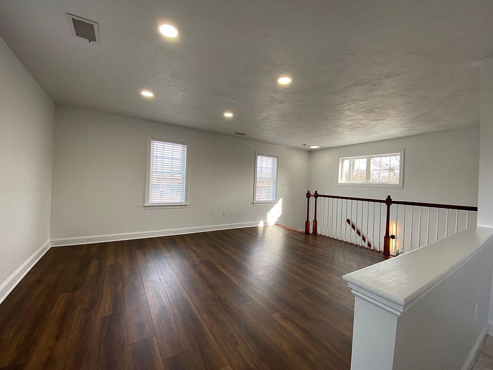 Living room with new white blinds just installed