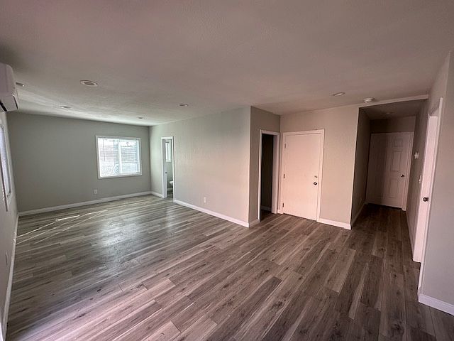 This photo illustrates the seamless flow between the kitchen and the living area, creating an open-concept space perfect for both everyday living and entertaining. The layout allows for easy interaction between the two areas.