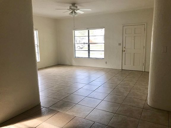 Front door opens to sunny living area.