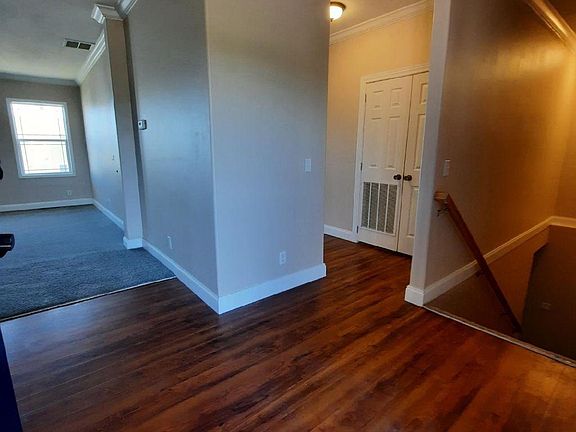 Front entry to living room, kitchen, guest bathroom, master bedroom and downstairs.