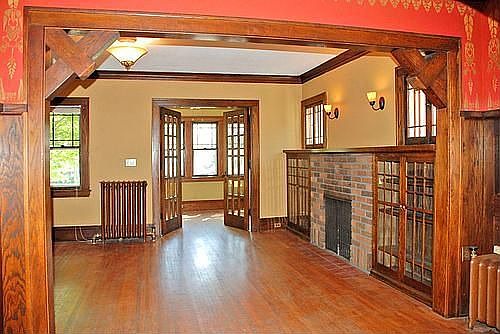 Hardwood floors, built-ins, wood-burning fireplace, natural woodwork 