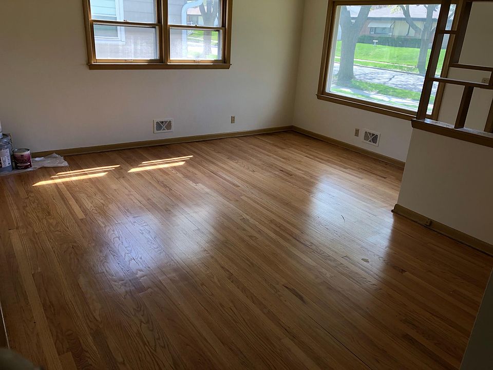 Sunny living room! The whole house has fresh paint and refinished hardwood floors.