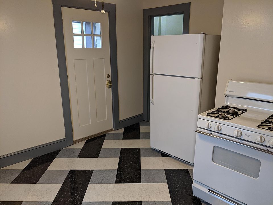 Main kitchen with newly installed tile floor in basket weave pattern.