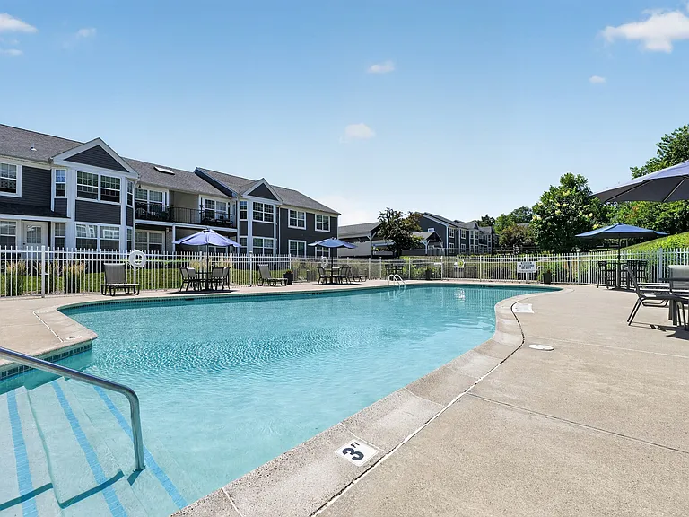 Enjoy a vibrant lifestyle at Summit at Mill Ridge, featuring a refreshing pool surrounded by beautiful landscaping and modern amenities. It's the perfect place to unwind and socialize. Schedule your visit today to see it for yourself!