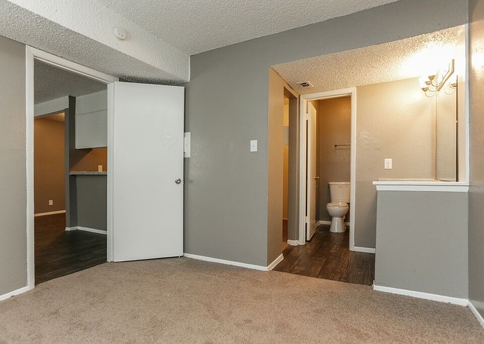 A spacious bedroom with a walk-in closet and ensuite access for convenience.
