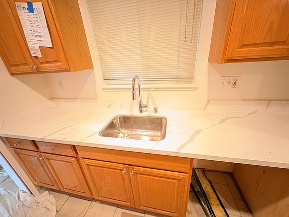 New kitchen countertop . before new LG Dish washer, all new 2" Faux blinds through out apt.