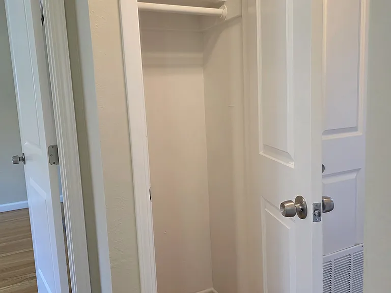 Coat closet located in the hallway.