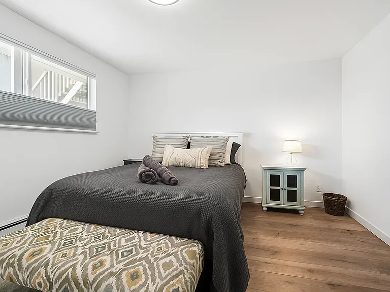 Enjoy this cozy queen bedroom a window for natural light