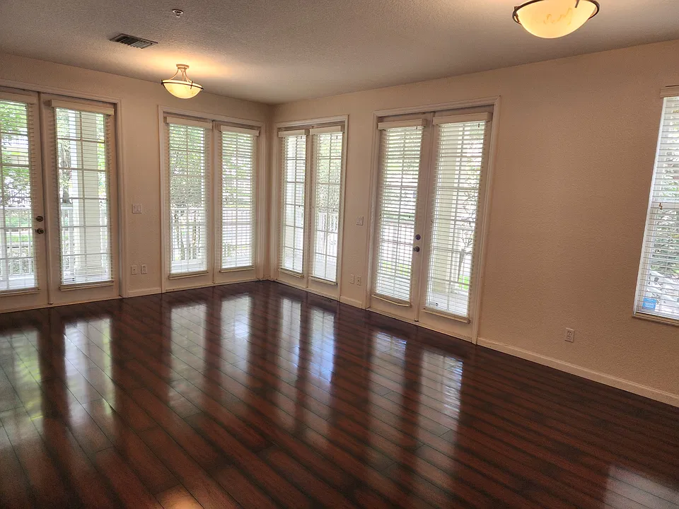 Great room with the front door on the right and left side entrance.