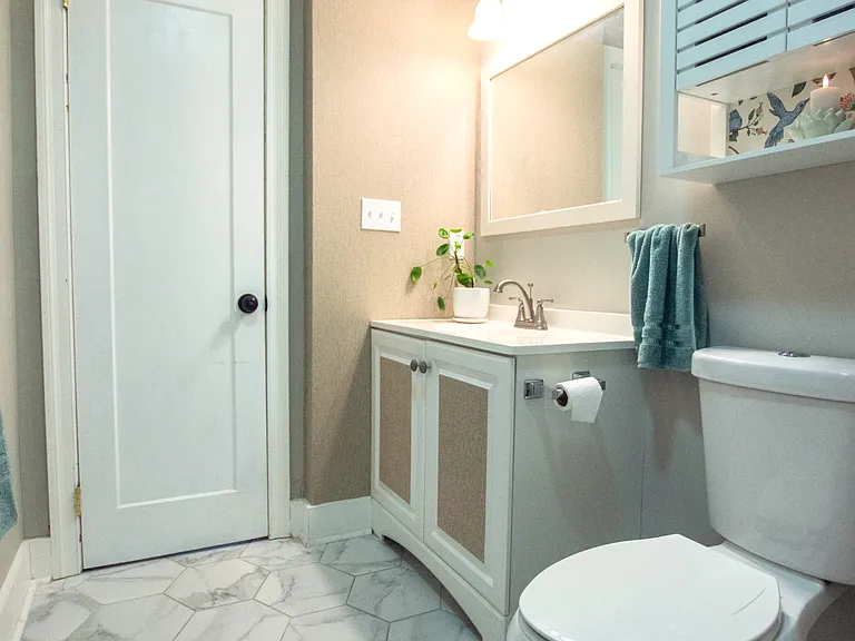 2nd bathroom with artwork and inviting accents