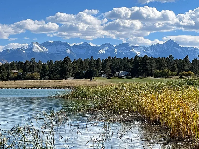 Pond on first hole with mountain view
