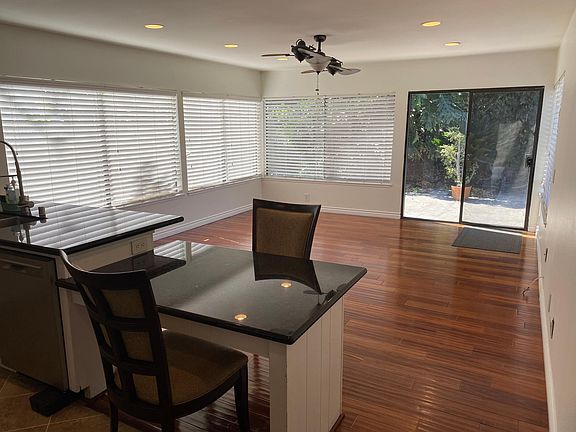 Family room adjacent to kitchen looking out on pool