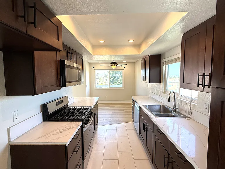 Kitchen with dining room in background