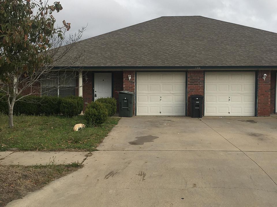 Front of Duplex with driveway