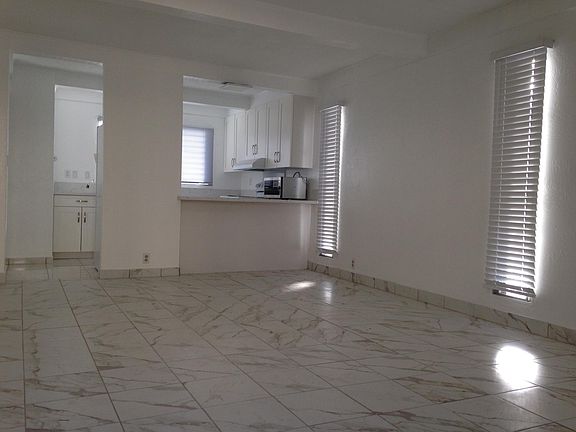 Open concept living-dining room + kitchen breakfast bar