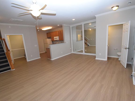 Great Room Looking Towards Kitche &Half Bath. Large Storage Closet To Left Of Kitchen