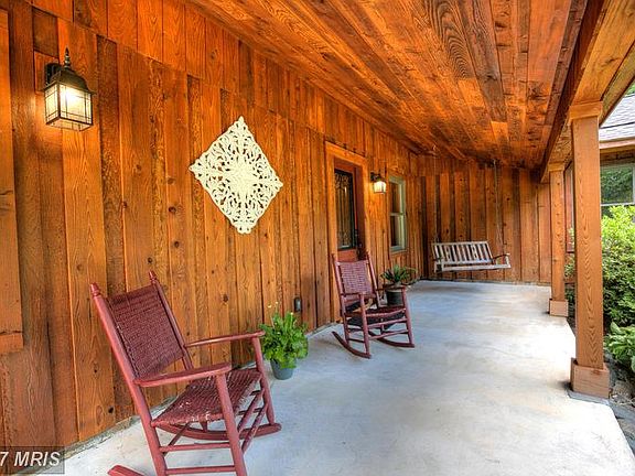 Warm cedar siding and relaxing front porch.