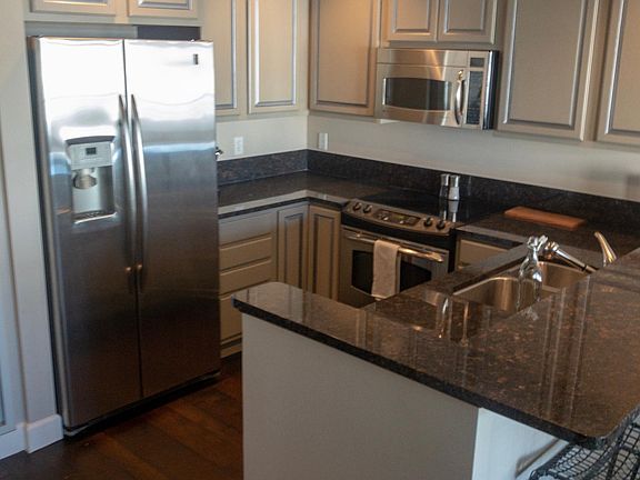 Kitchen (granite counter tops, ss appliances, custom painted cabinets