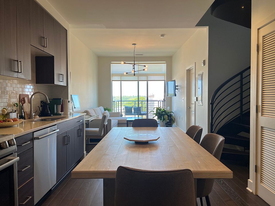 Light-filled Open concept living with a West Elm Dining Table that seats up to 6