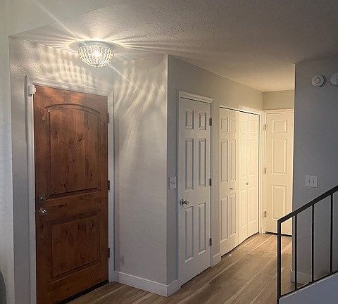 Front door, hall all to downstairs bathroom, laundry, stairs, and garage