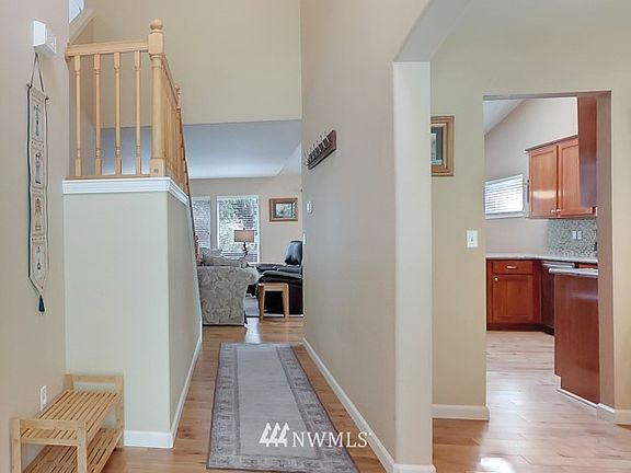 Spacious entry with gorgeous hickory engineered hardwood flooring.