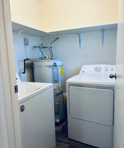 Full sized washer and dryer and plenty of storage in separate, in-unit laundry room.