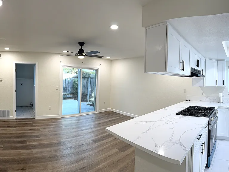 Kitchen and family room with access to patio yard and laundry room