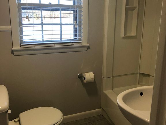 full ball with full size tub and shower, tile floor