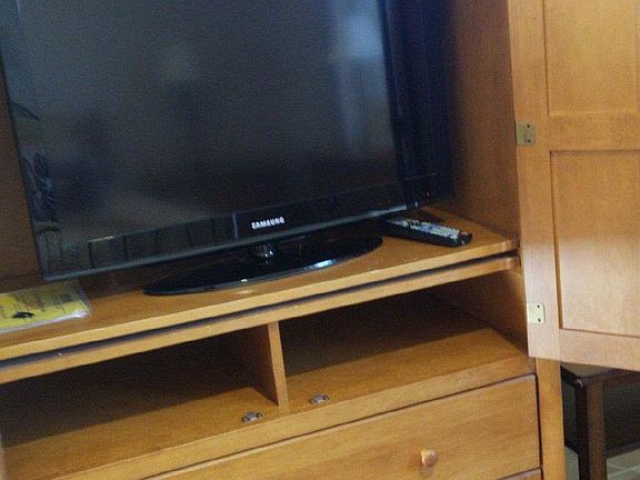 Large Cox Cable TV inside Storage Armoire