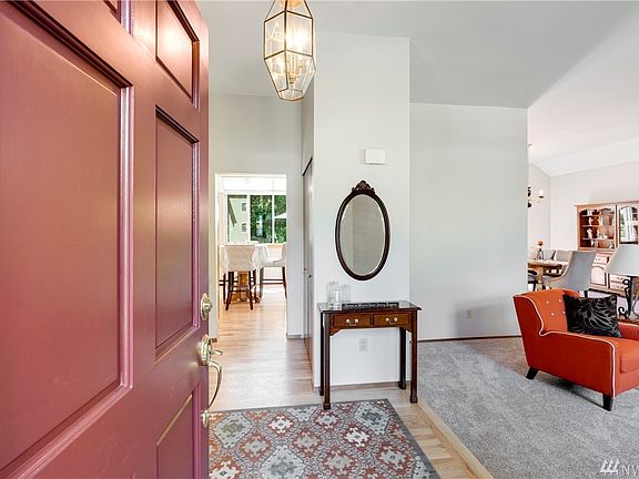 Inviting entry offers a first look into the formal living and dining rooms.