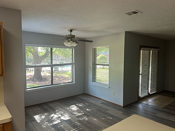 breakfast nook off kitchen area with dooble doors leading to patio area