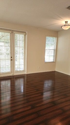 The front door and living room are looking out to Common Way Rd.
