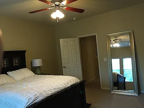 Spacious primary bedroom with walk-in closet and ensuite bathroom.