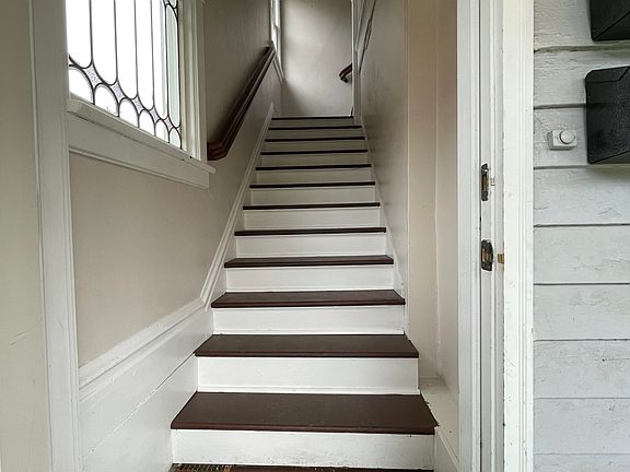 Stairs from entry up to apartment.