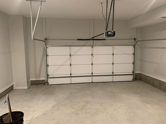 2 car oversized garage with outside 2 car parking pad, additional off street parking available.