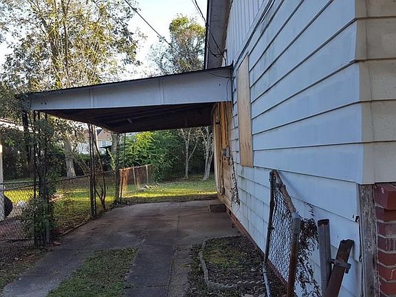 Side showing carport
