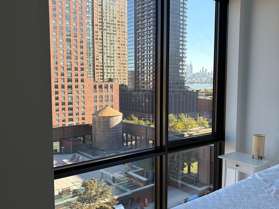 View of Manhattan from the main bedroom through floor-to-ceiling windows