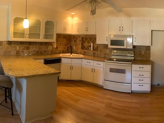 Panorama of kitchen and dining.