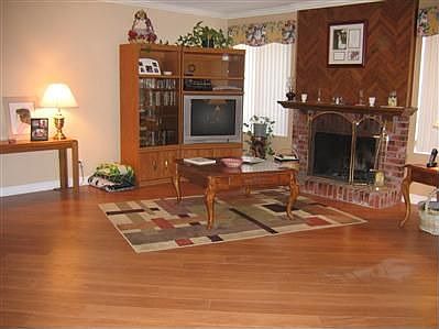 living room w/gas fireplace, premium hardwood flooring