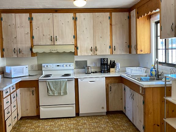 Kitchen with electric stove and dishwasher