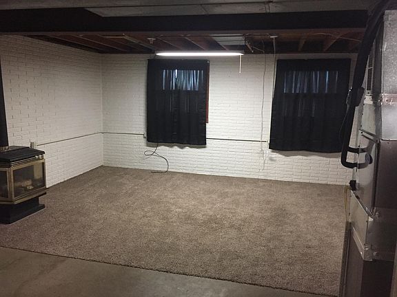 family room in basement with full windows. upstairs living r