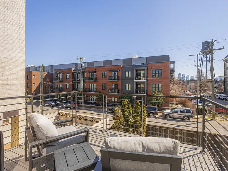 Private Balcony attached to the Master Bedroom with cozy outdoor seating. Views of downtown!