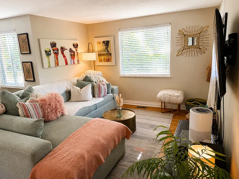 Living-room showing large full size sectional couch with chaise lounge.