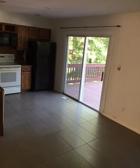 Eat in tiled kitchen w/slider to a relaxing deck, overlooks