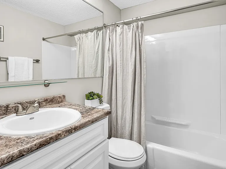 Embrace daily pampering in our stylish upgraded bathrooms, where oversized mirrors and granite-style countertops create an elegant retreat.